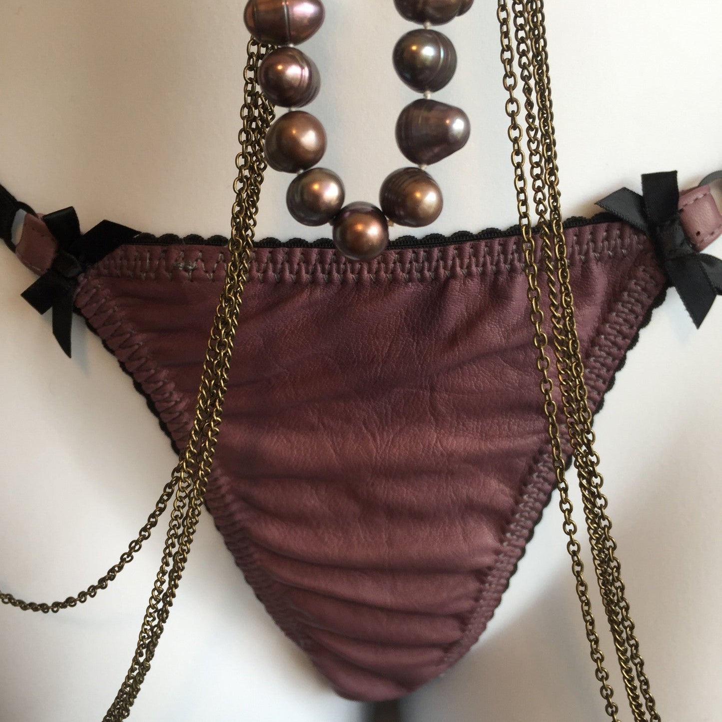 Leather Adjustable G-string briefs for women in black, with bow accents