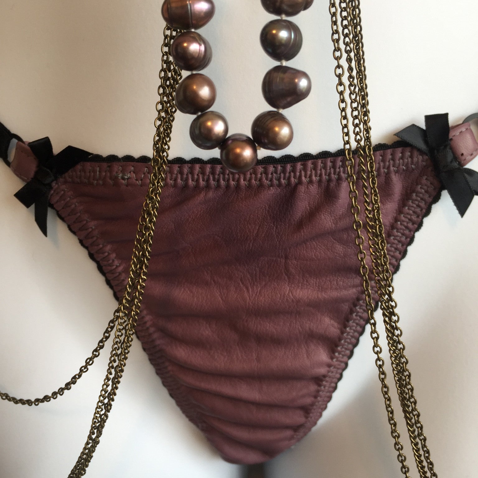 Leather Adjustable G-string briefs for women in black, with bow accents

