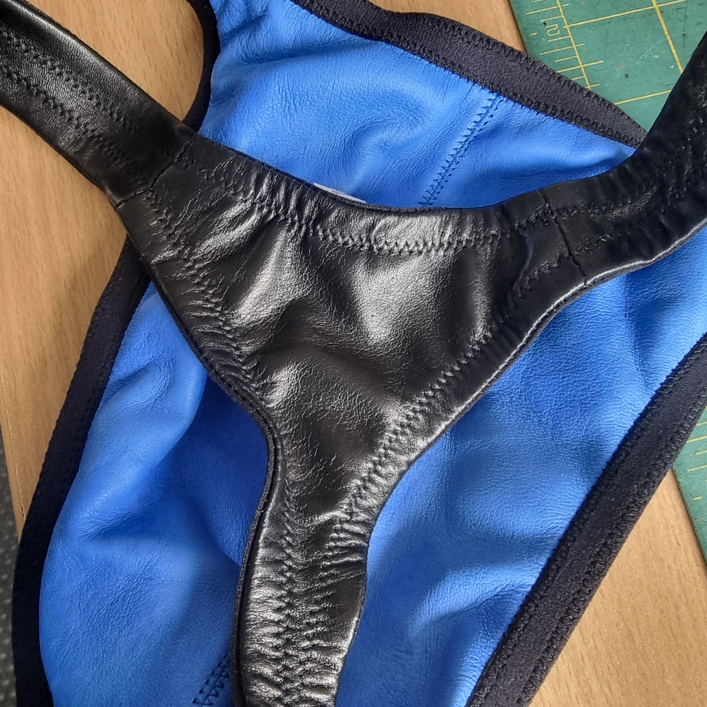 Men's black leather thong with azure lining—washable glove leather, size 34/M

